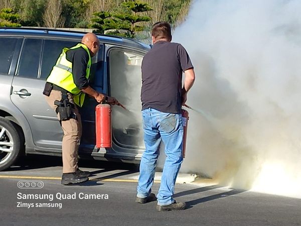 Member from security services help contain vehicle fire on Baden Powell Drive