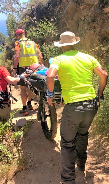 Woman rescued on high-tech “mountain-bike stretcher”