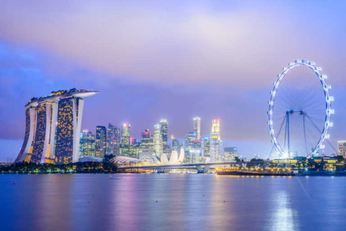 Singapore skyline at night Kick-Off Your First Travel Adventure To Singapore After Lockdown