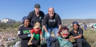 At the Mandela Day initiative to clean up an area in Bethelsdorp yesterday were (from left) Brenda Jonas, with mascot Zisa, Kay Hardy, SPAR EC sponsorships and events manager Alan Stapleton and Emmy Nxayeka, with mascot Nondalo. Photo: Leon Hugo