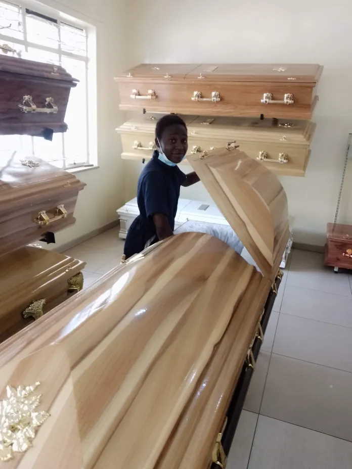 Zimbabwean Teenage girl works with the dead