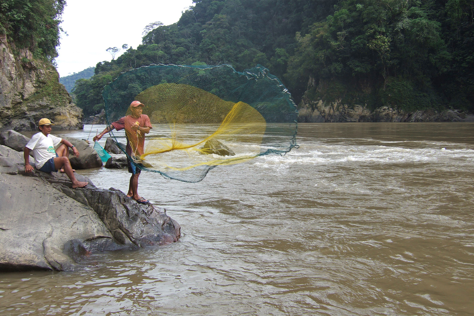 Fishermen cast netting on the Pongo de Manseriche.