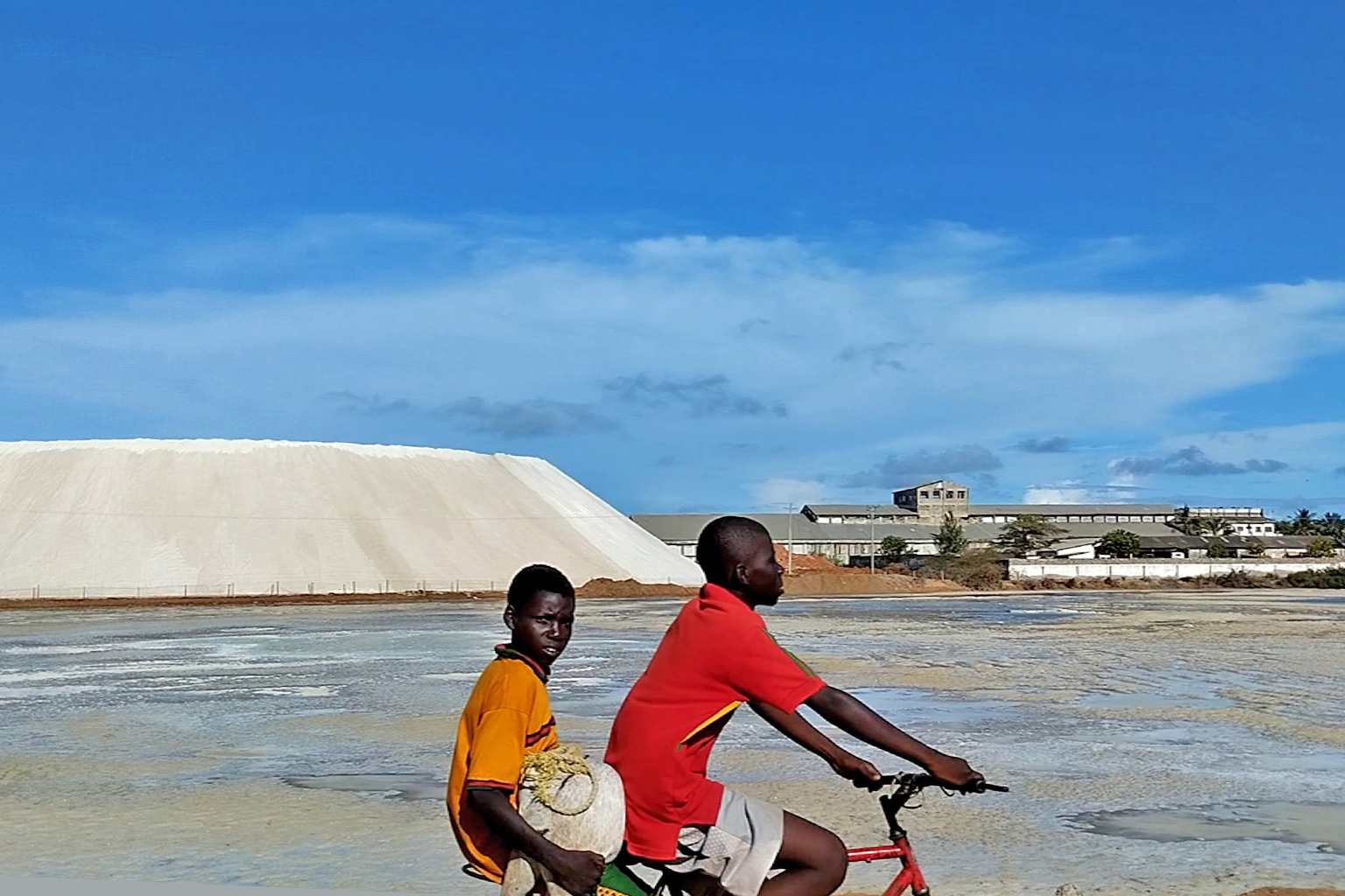 A cyclist rides past Krystalline Salt Limited in Marereni.