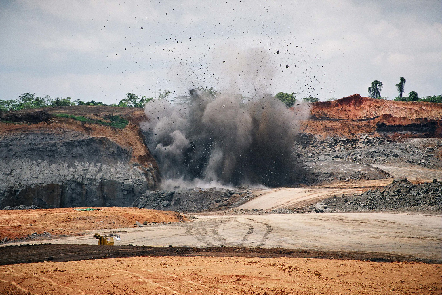 A coal mine site being cleared with dynamite to access the vein of coal