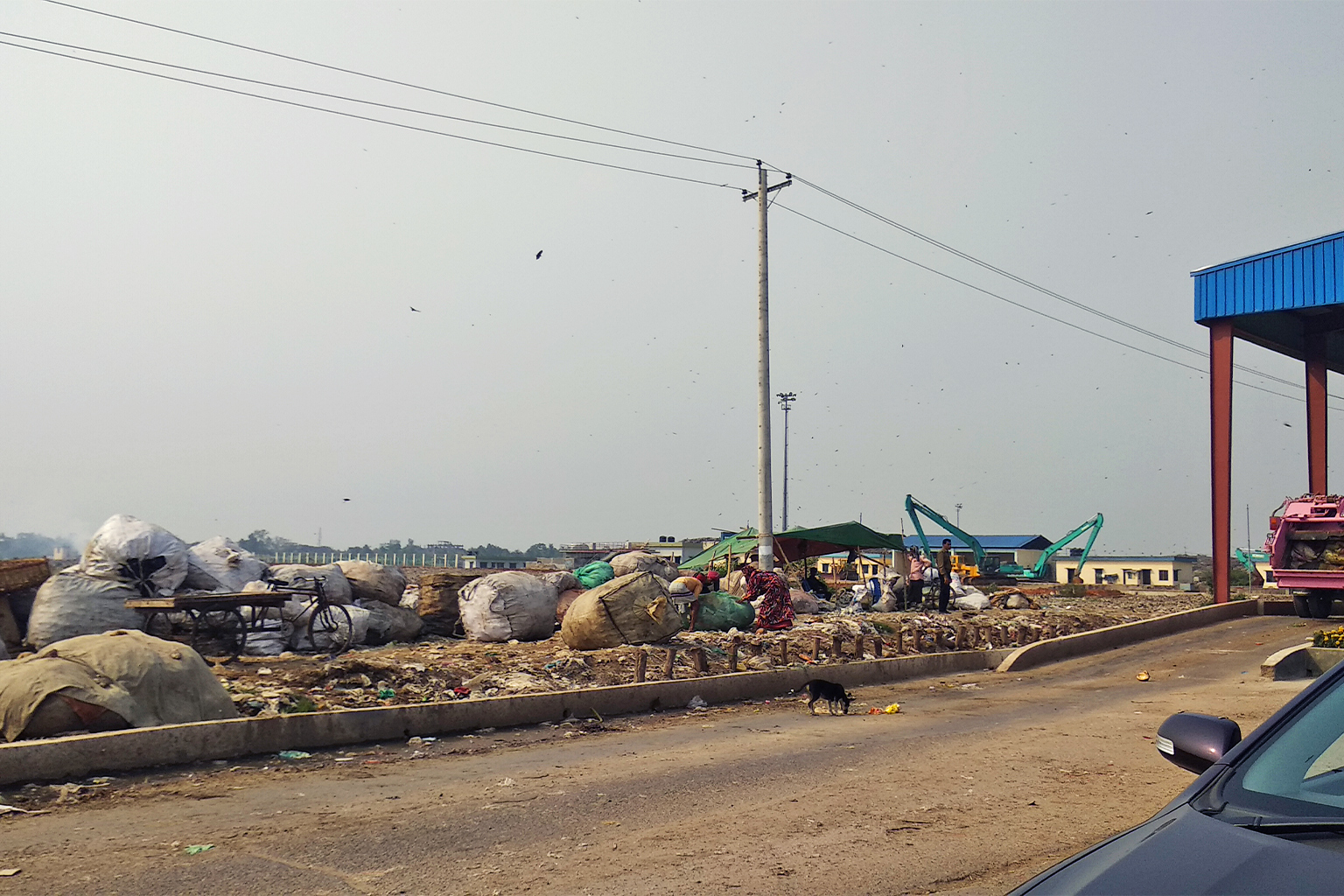 Waste dumped next to a highway in Bangladesh.
