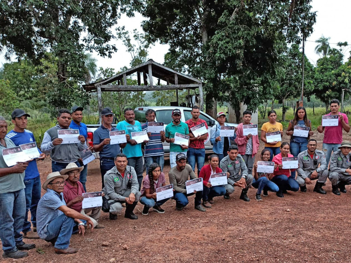 Community members with certificates.