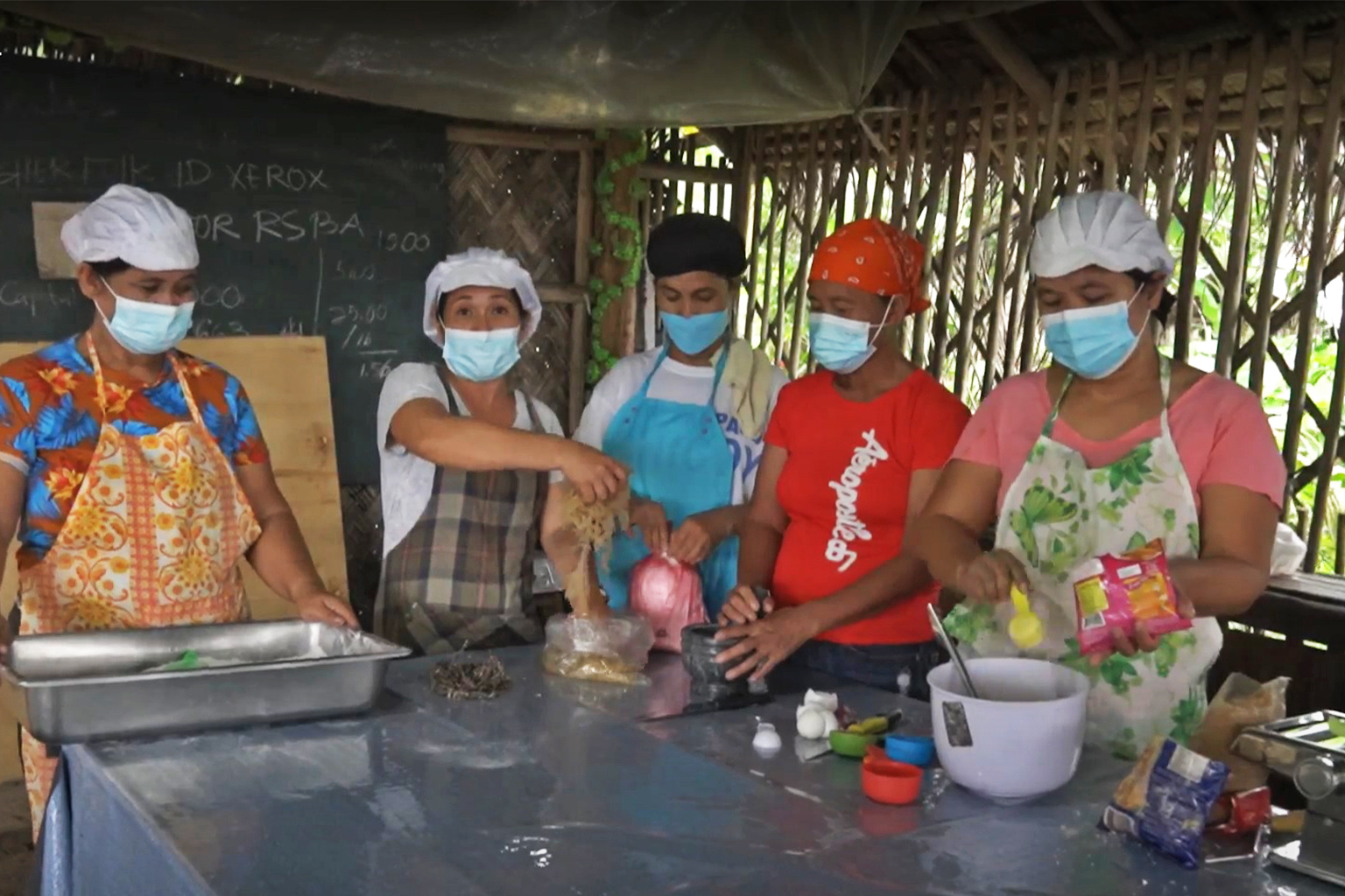 Women at Palawan's Cherish Fisherfolk Association make noodles and chips