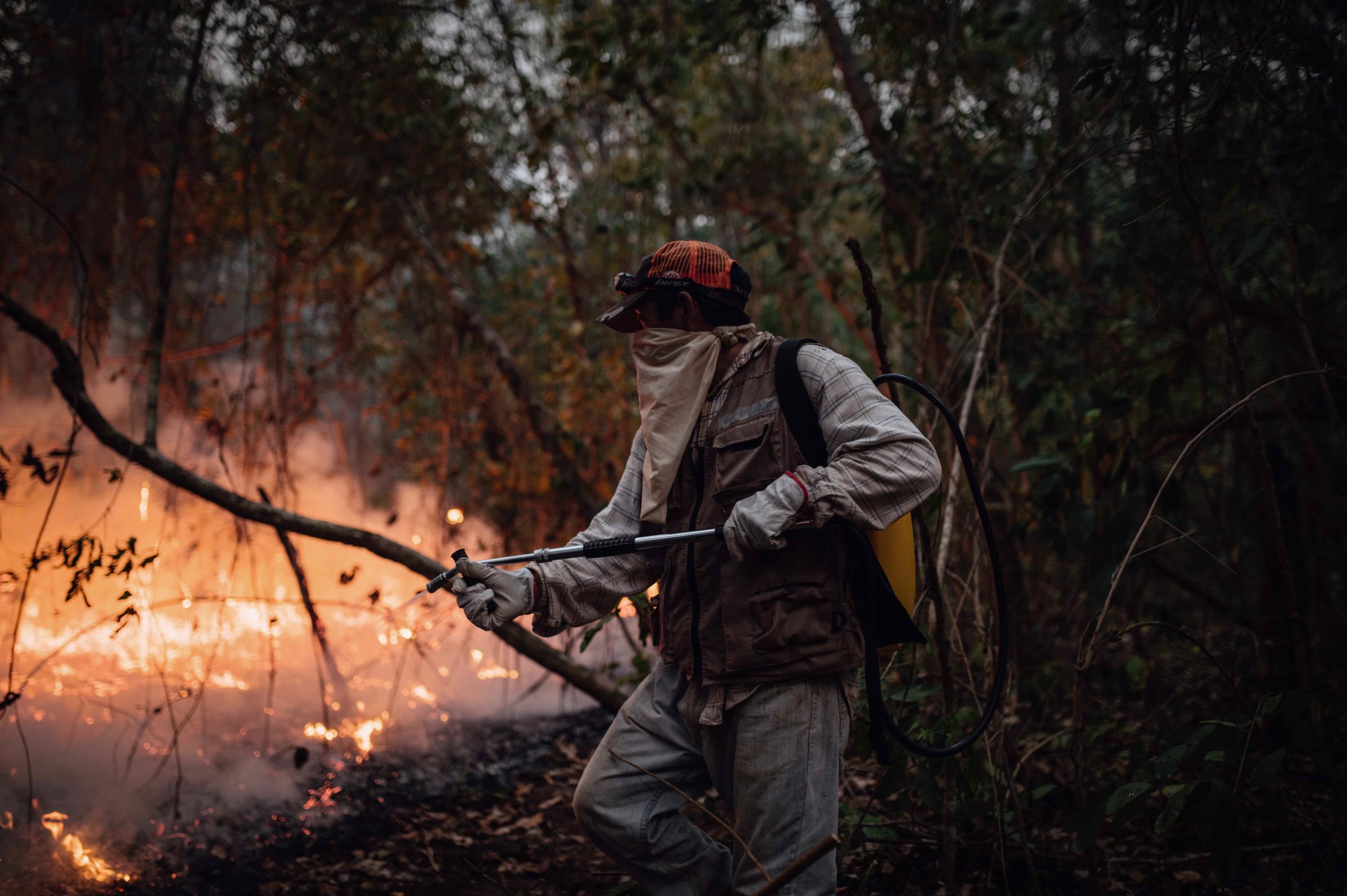 A community member from Santiago de Chiquitos fights a fire on the border of the Tucabaca Valley protected area. Image by Claudia Belaunde.