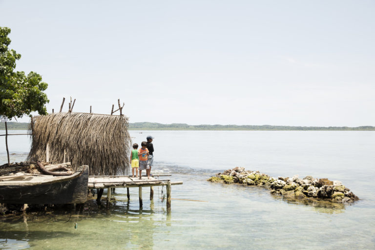 Fishing and playing, Isla Soledad Mandinga, Guna Yala, Panama. Coral is used around the island to extend the island. Image courtesy of If Not Us, Then Who.