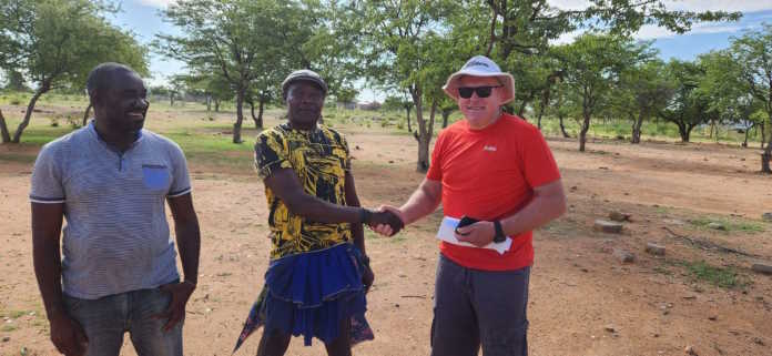 Deon van der Mescht the CEO of African Nickel (orange shirt and hat) with staff