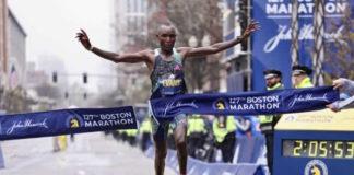 BOSTON, MASSACHUSETTS - APRIL 17: Evans Chebet of Kenya crosses the finish line and takes first place in the professional Men's Division during the 127th Boston Marathon on April 17, 2023 in Boston, Massachusetts. (Photo by Maddie Meyer/Getty Images)
