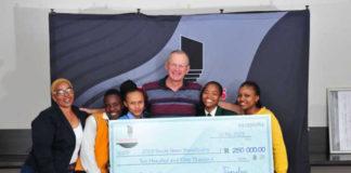 Theo Morkel, General Manager of Transalloys with some of the bursary recipients
