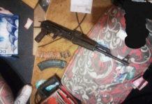 Man nabbed for possession of a rifle and stained cash