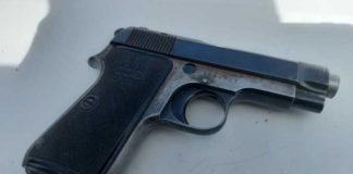 Police members arrest suspect with unlicensed firearm