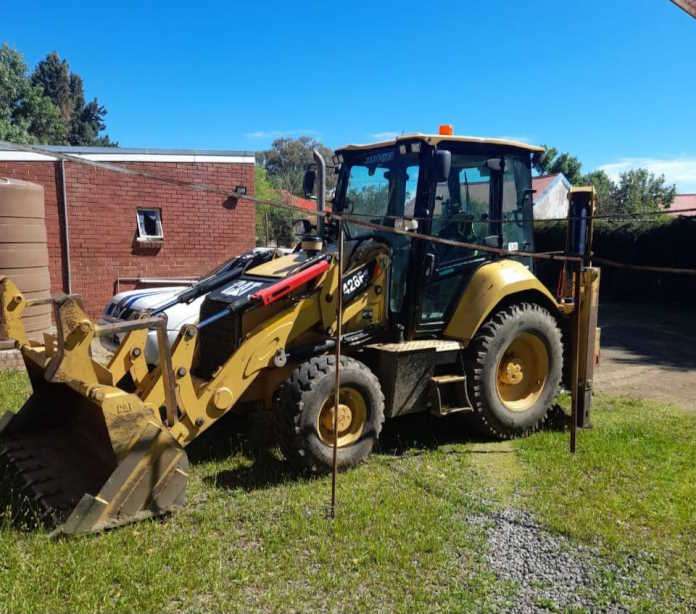 Farmers on blue and white patrols prevent theft of tractor-loader-backhoe vehicle