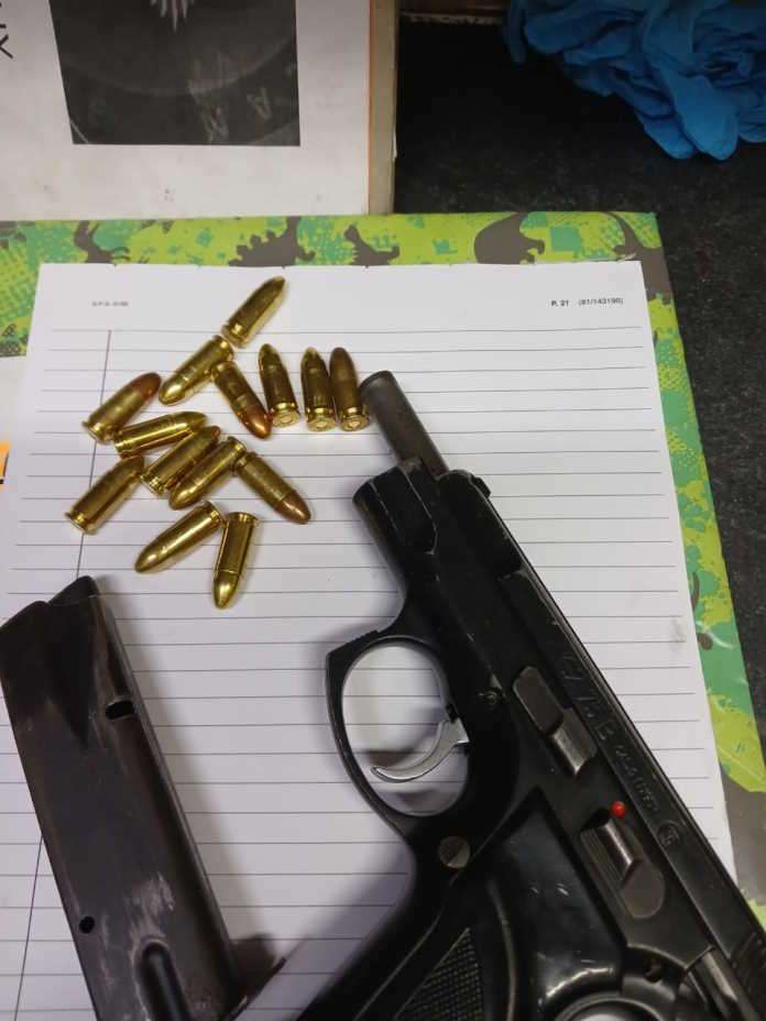 Police members arrest suspect for possession of a prohibited firearm Police members arrest suspect for possession of a prohibited firearm