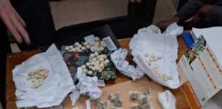 Court orderly detains an attorney on a charge of possession of drugs