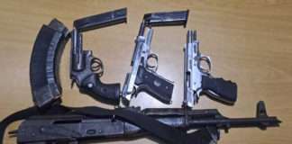 Wanted suspects nabbed with firearms Wanted suspects nabbed with firearms