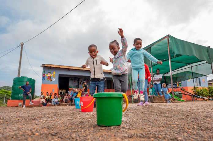 Children playing outdoors at ECD centre in Phongola