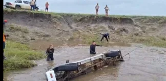 Eight bodies retrieved after vehicle swept into a stream
