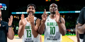Al Ahli’s Mohamed Abdourahman #13 and Caleb Agada #10 celebrate the team’s last win and their 6-0 record in the Nile Conference group phase at BK Arena in Kigali, Rwanda on May 25, 2025.