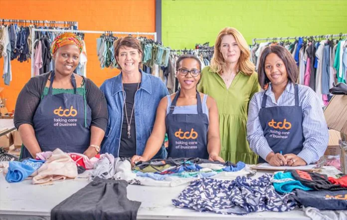 Tracey and Tracey with the women benefitting Tracey and Tracey with the women benefitting