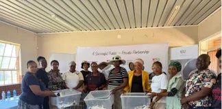 Community members from Brits in the North West receive hygiene products following the educational workshop