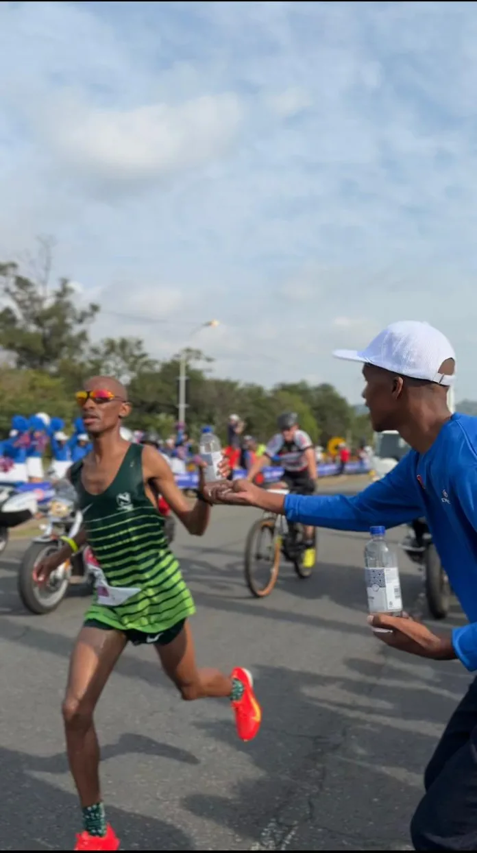 Tete gratefully accepted a bottle of Engens supercharged private label water at the Blue Mile Fan Stop