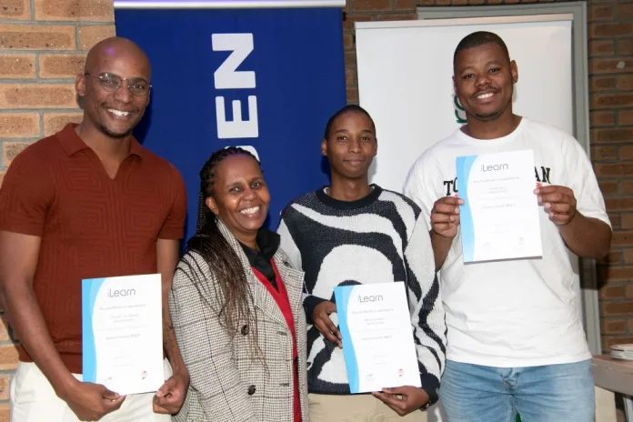 Zoli Mazibuko iLearn Facilitator and the 3 graduates who secured positions at Engen