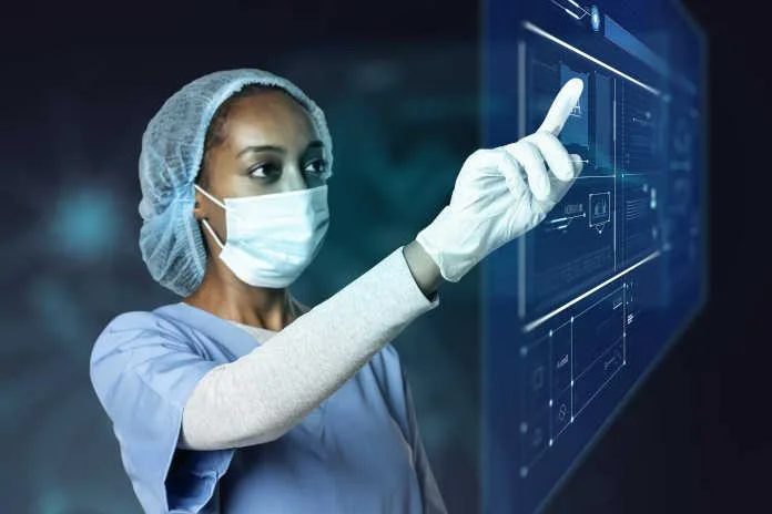 doctor-touching-modern-virtual-screen-interface From Operating Room to Online Safety: Regulating the AI Revolution in Medicine