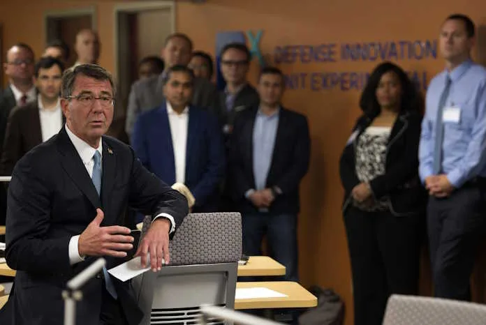 Defense Secretary Ash Carter speaks with Defense Innovation Unit Experimental employees as he arrives at Moffett Field, Calif., to deliver remarks at DIUx, May 11, 2016.
