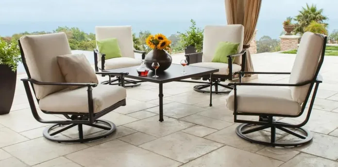 Modern patio with cushioned swivel lounge chairs and a square metal table, designed for luxury outdoor dining at restaurants, wineries, and upscale residential spaces.