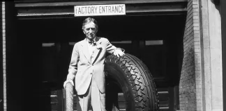 Harvey Firestone Sr. with original Firestone non skid tire and large tire - Akron Factory 1926 - 1930