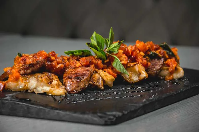 North West Grilled Corn and roast pepper Sheba served with chicken