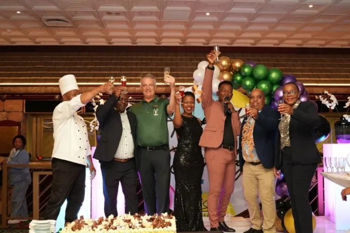 (left to right): Cheers to 44 years of Wild Coast Sun entertainment with Sous Chef, Godfrey Setwe; Wilbert Maponga, VIP personal Host; Gaming Manager, Mark Ferguson, Marketing Manager, Cynthia Dumakude, Katlego Maboe (Emcee); Resort General Manager, Henry Tshegetso Boekhouer; and Rosemary Cele Surveillance & Security Manager