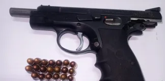 Police Seize Illegal Firearm and Arrest Murder Suspect Police Seize Illegal Firearm and Arrest Murder Suspect