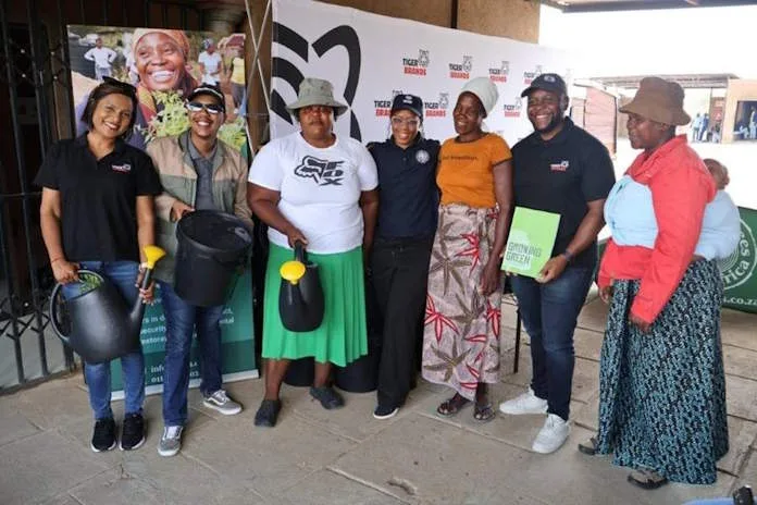Sylvia Mokete, Food Gardens Administrator in the centre, pictured with Tiger Brands and other representatives 
