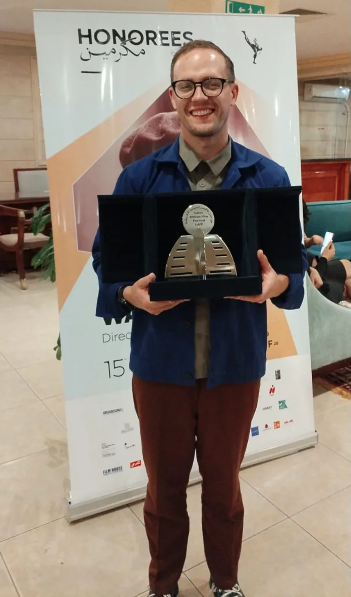 Michael-James-with-his-award-the-Radwan-El-Kashef-Prize-for-Best-Film-Addressing-an-African-Issue Michael James with his award the Radwan El Kashef Prize for Best Film Addressing an African Issue